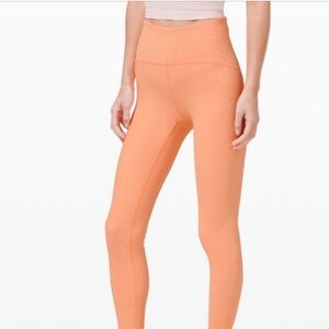 Lululemon Align Cropped Leggings in a peachy pink